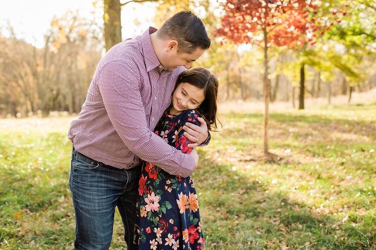 Father giving daughter a bear hug | KGriggs Photography