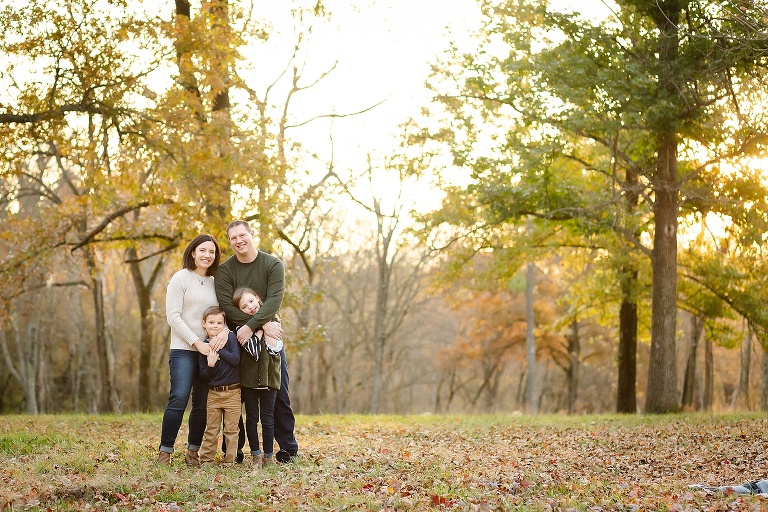 Family of four standing in park during fall | KGriggs Photography