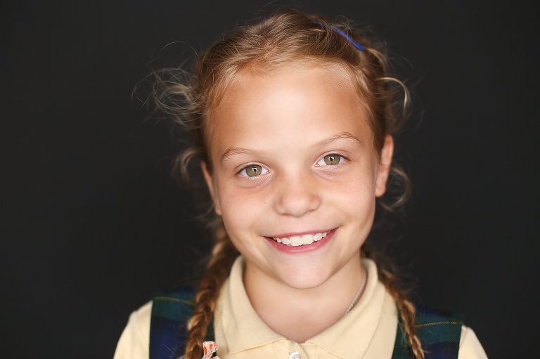 School photo of young girl with braids in her hair | St. Louis School Pictures