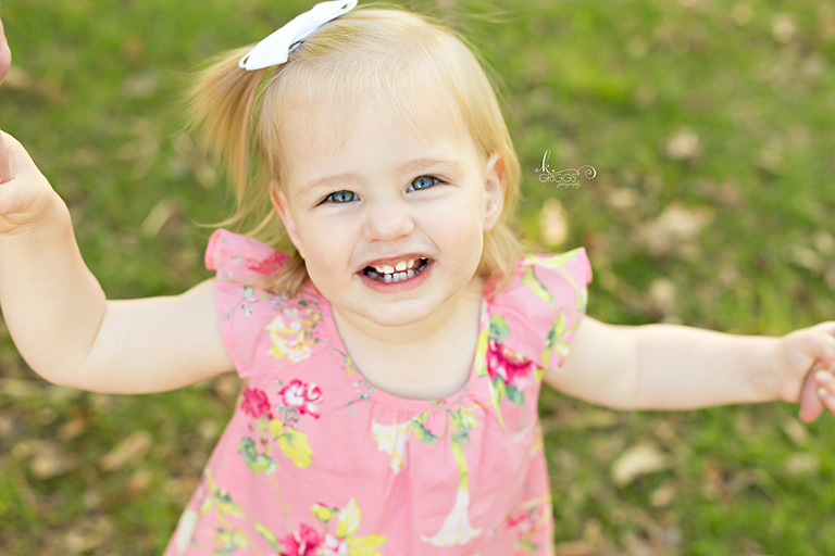 Little girl smiling at camera. | St. Louis Children's Photographer