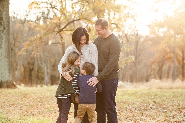 Family of four having a family hug | KGriggs Photography