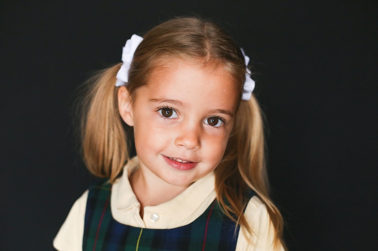 School photo of young girl with two pig tails | St. Louis School Photographer