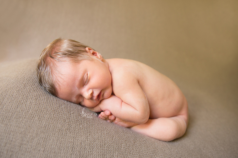 Newborn baby on a brown blanket | St. Louis Newborn Photography
