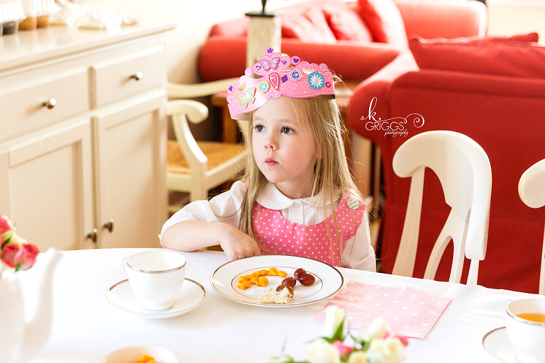 Little girl sitting at table wearing tiara | St. Louis Family Photographer