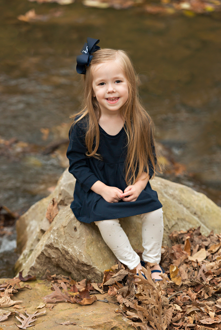 Young girl looking at camera smiling | St. Louis Photography