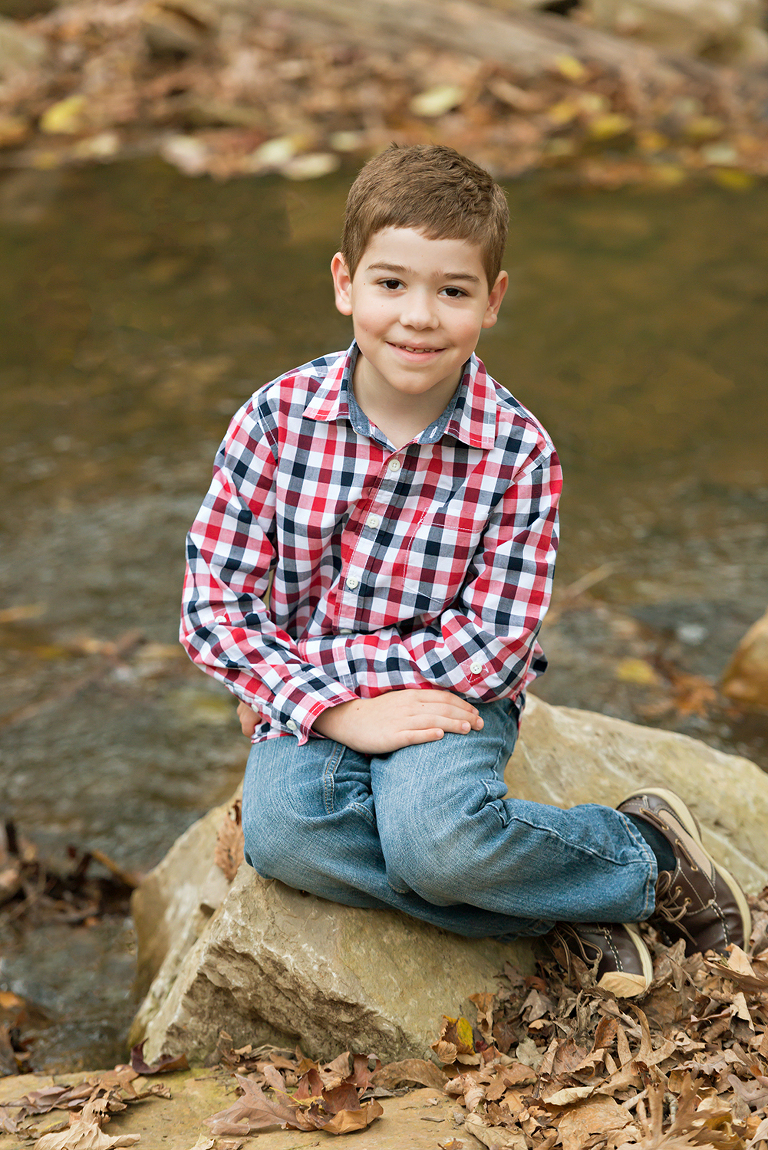 Young boy sitting on rock | St. Louis Children's Photographer