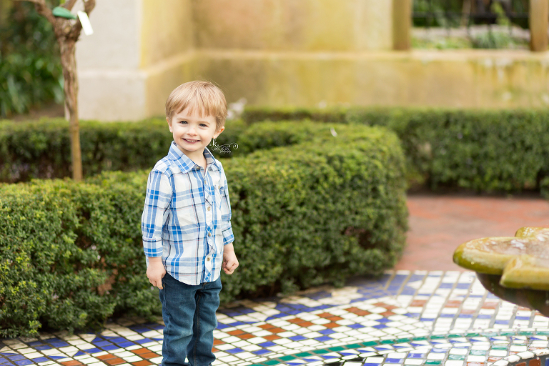 Young boy standing near small pool - St. Louis Children's Photographer