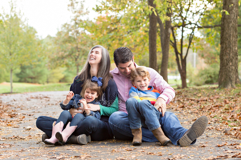 Neighbors sitting on path on fall day | St. Louis Family Photographer