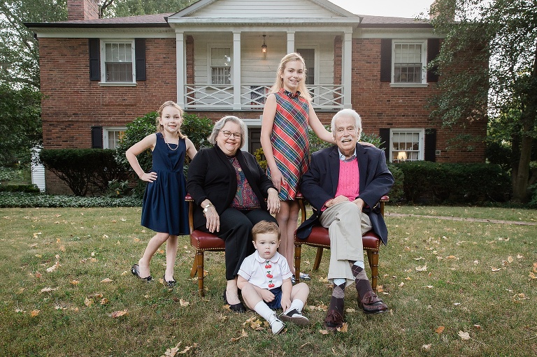 Grandparents with 3 of their grandchildren in front of house | St. Louis Family Photographer