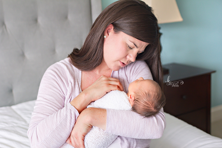 mom with newborn baby girl