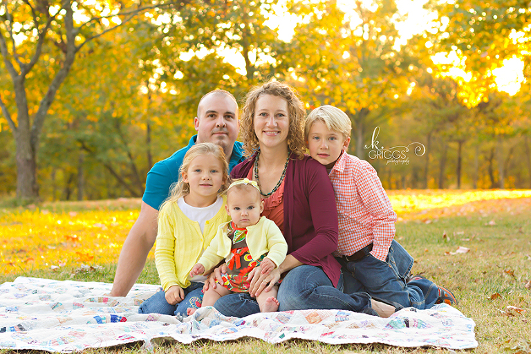 St. Louis Family Photographer - KGriggs Photography - family sitting in grass - Queeny Park, St. Louis, MO