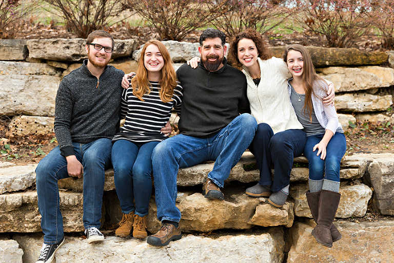 Family of 5 sitting on rocks | Kirkwood Photography