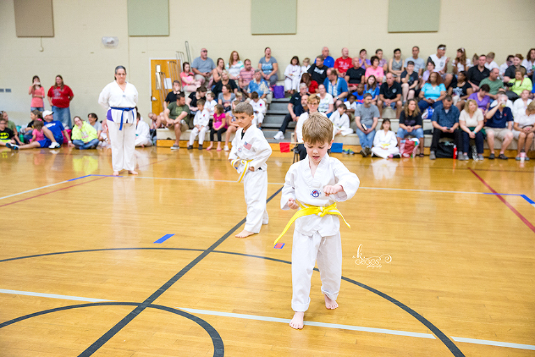 young boy performing martial arts | kirkwood family photographer