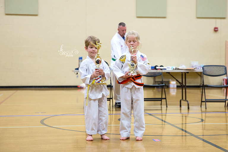 two kids with trophies | kirkwood children's photographer