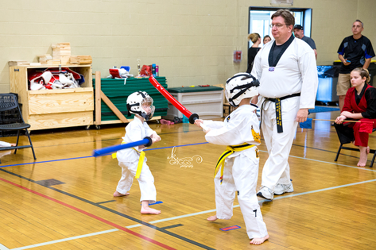 two boys fighting with swords | st louis family photographer