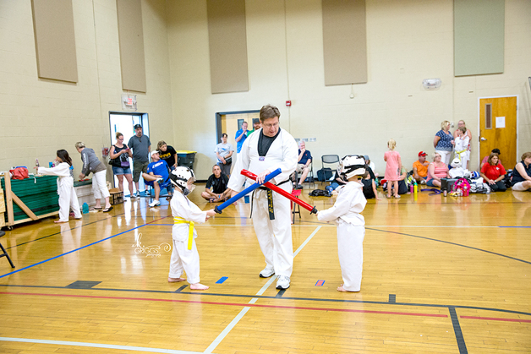 two boys with foam swords crossed | st louis photographer