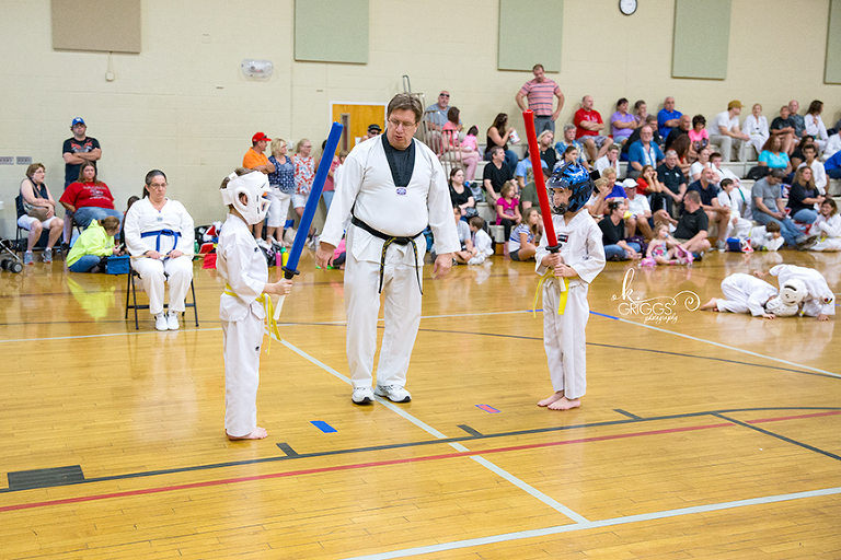 two boys ready to start foam sword fighting | st louis photos