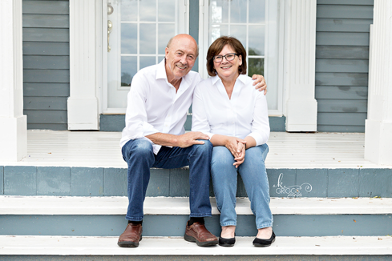 Couple sitting on steps of their house | St. Louis Family Photography