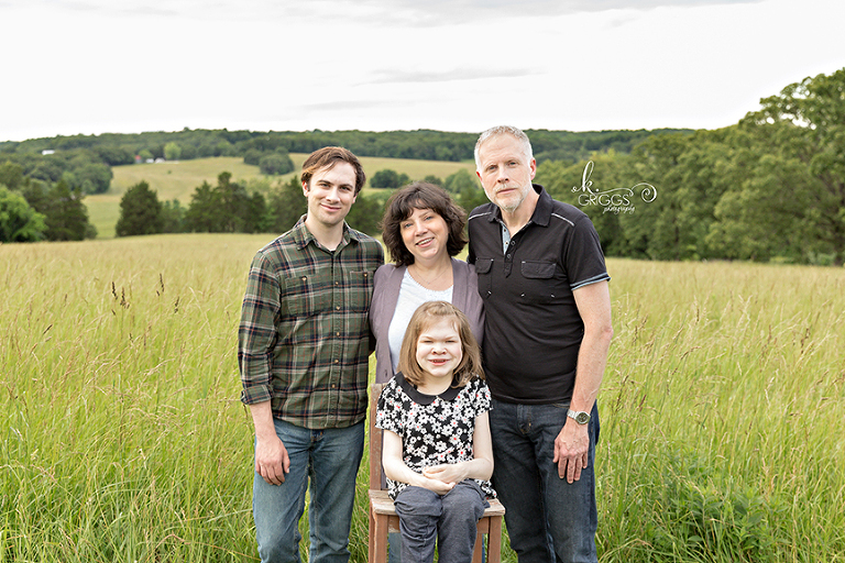 Family of 4 in a field of grass | St. Louis Photography