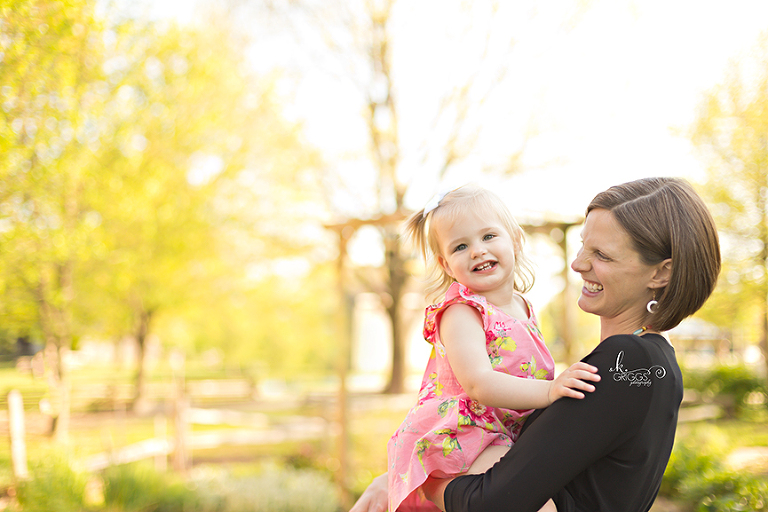 Mom smiling at her sweet daughter. | St. Louis Photography