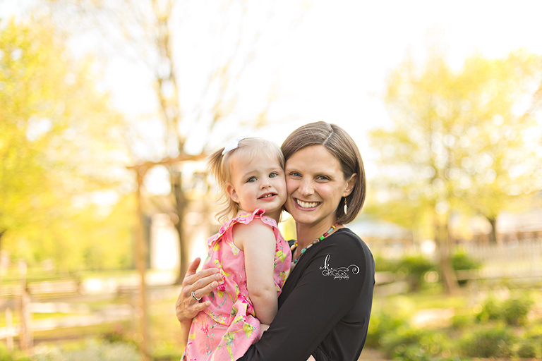 Mom and daughter smiling for camera. | St. Louis Portraits