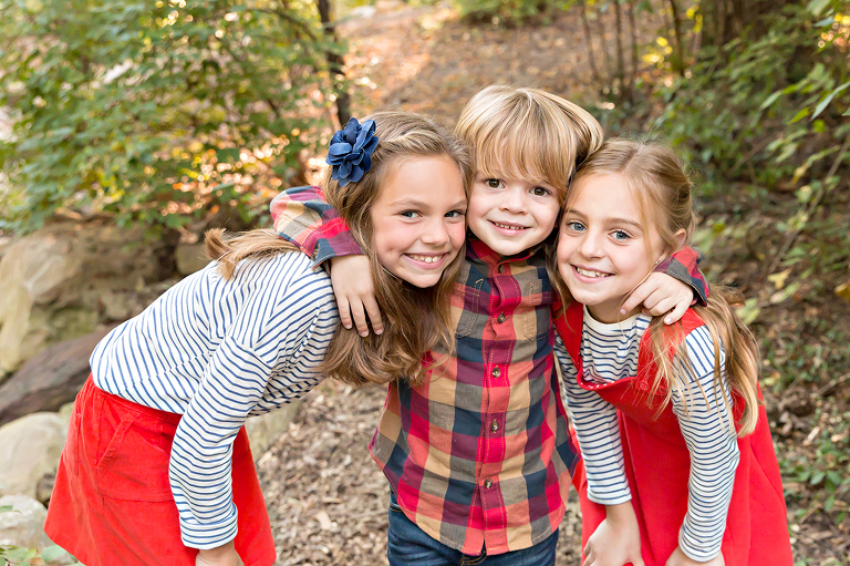 Two sisters and their little brother in Longview Farm Park | St. Louis Family Photographer