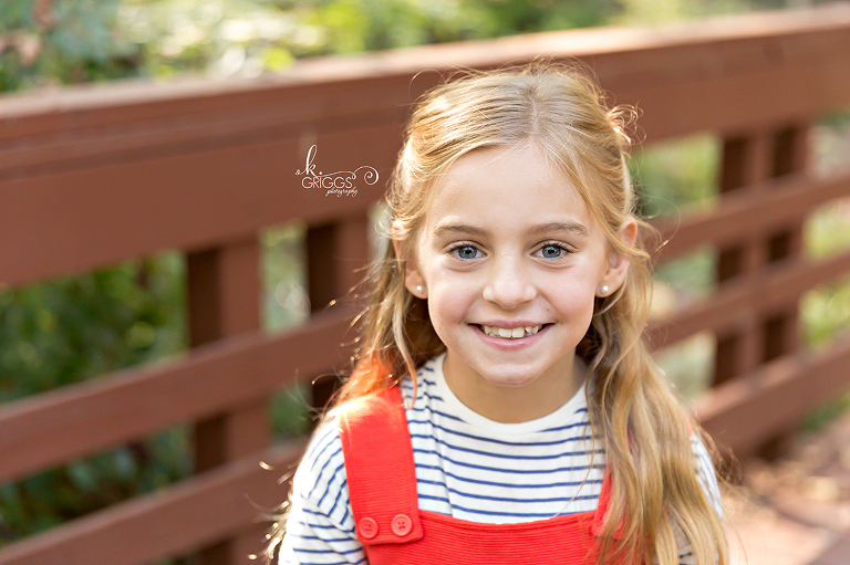 Sweet blonde girl smiling at camera Longview Farm Park | St. Louis Photographer