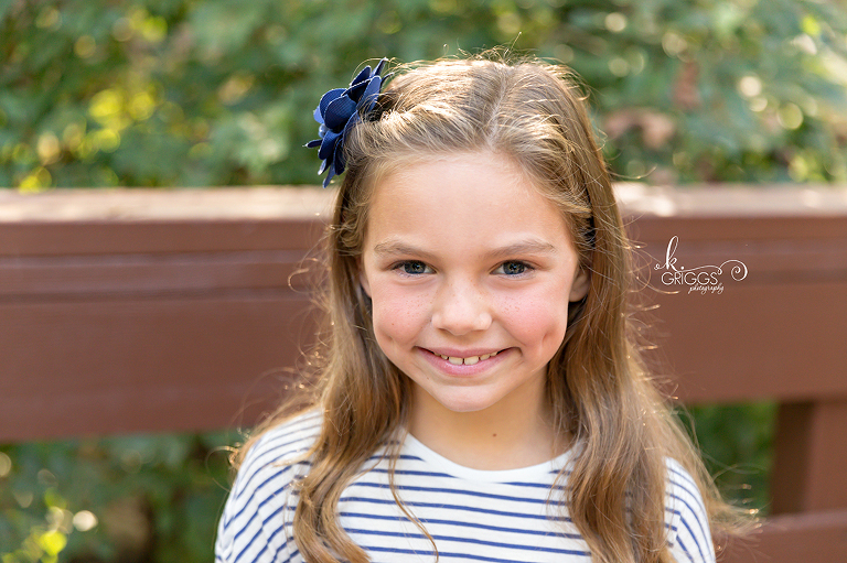 Sweet girl with dimples smiling Longview Farm Park | St. Louis Family Photographer