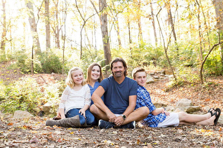Family of 4 sitting on ground in park - Longview Farm Park | St. Louis Photos