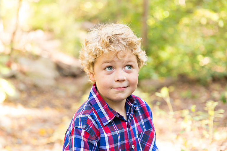 Young boy looking sideways with his eyes | St. Louis Photos