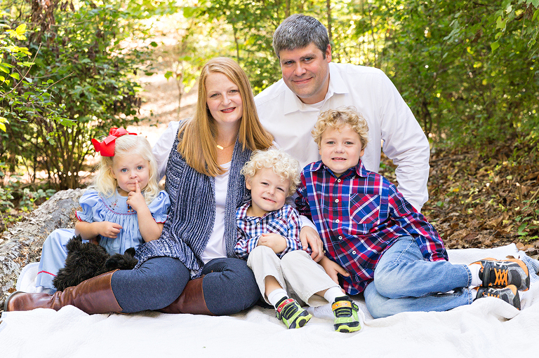 Family of 5 sitting on blanket in wooded area - Longview Farm Park | St. Louis Photographer