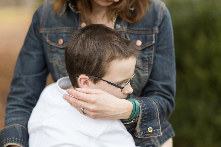Young boy hugging his mother. | Kirkwood Children's Photography