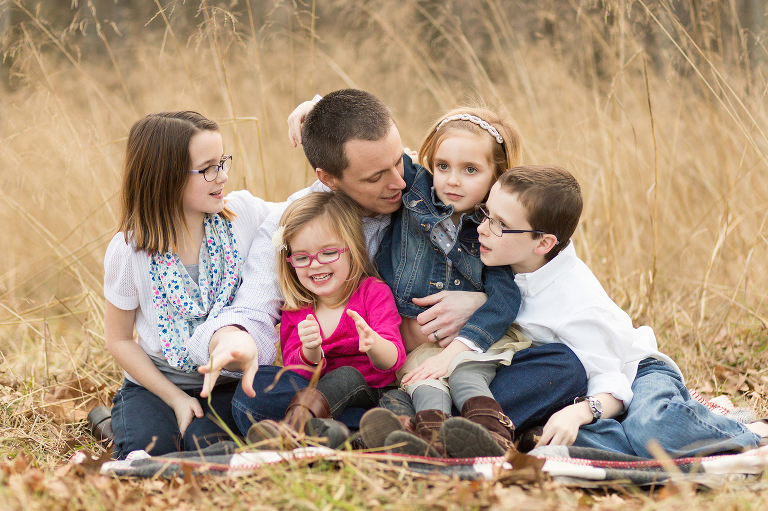Daddy with his four kids having fun. | St. Louis Family Photography