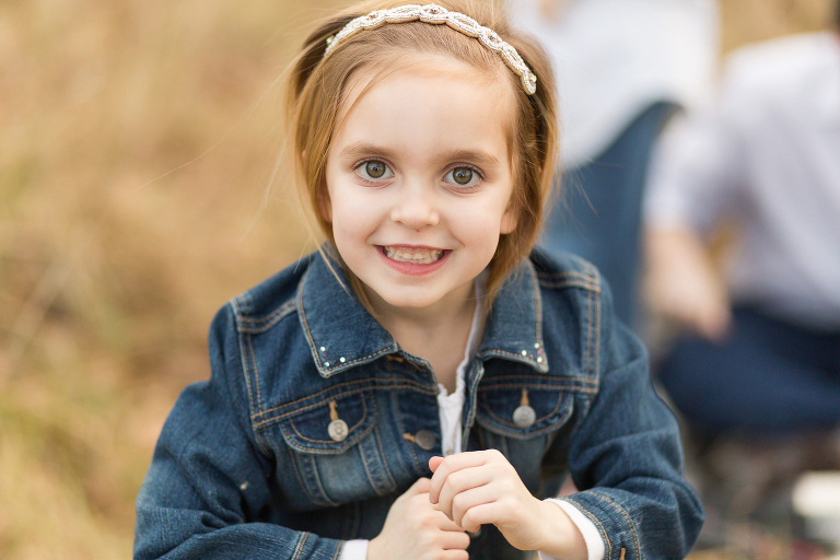 Young girl smiling looking at camera | Kirkwood Family Photographer