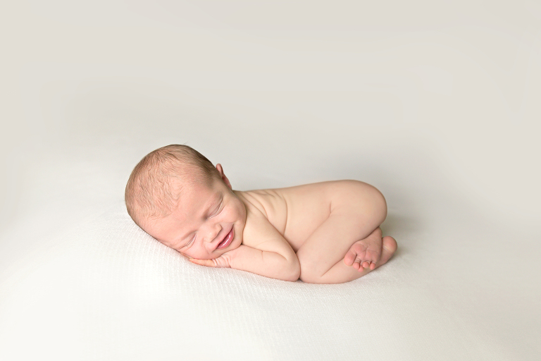 Baby girl laying on tummy on blanket {St. Louis Newborn Photo}