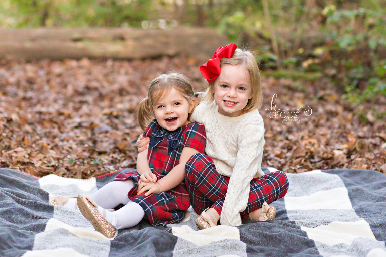 Sisters sitting on blanket smiling at camera | St. Louis Family Photography