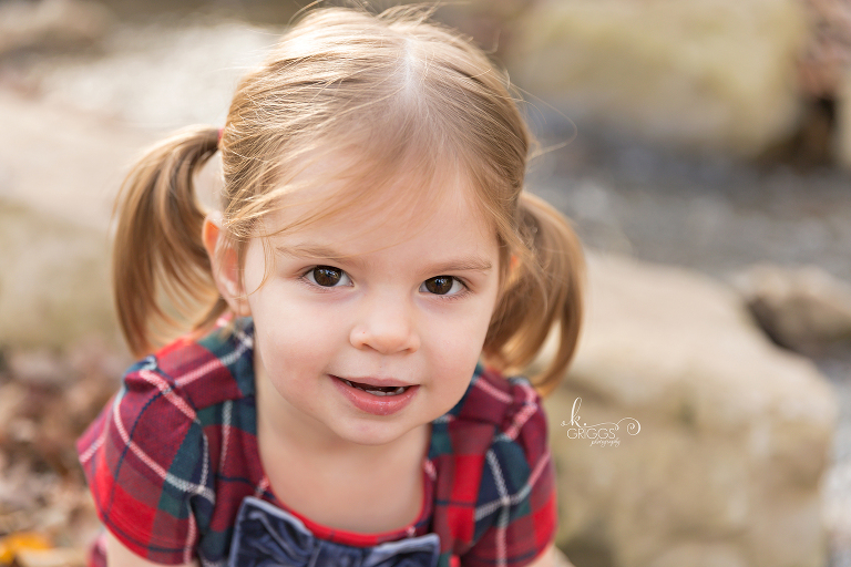 Young girl looking at camera smiling | St. Louis Photographer