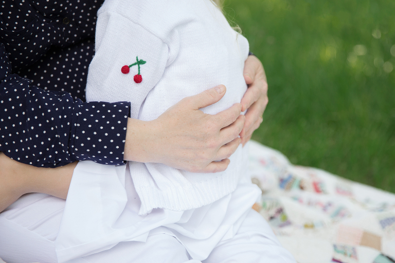 mother's hands wrapped around little girl | St. Louis Family Photographer