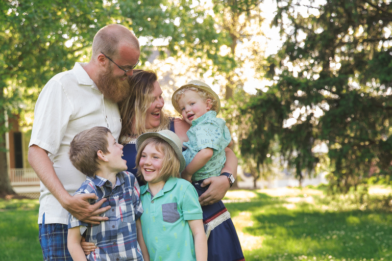 Mom, Dad, and three boys enjoying evening | St. Louis Family Photographer