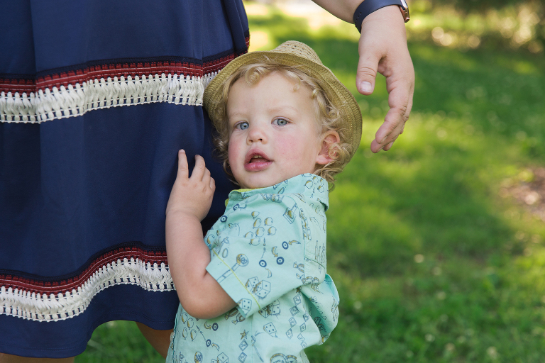 Little boy hugging mother's leg | KGriggs Photography