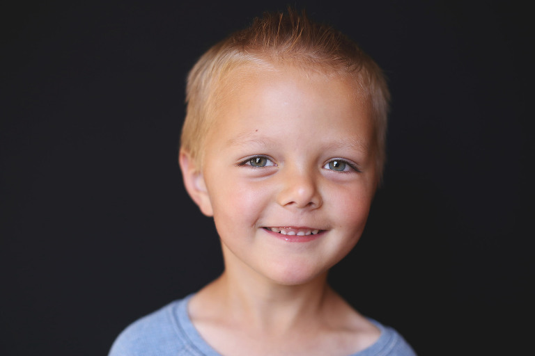Young boy looking at camera and smirking | St. Louis School Pics