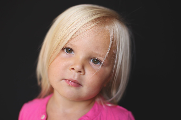 Blonde haired toddler girl looking at camera | St. Louis School Photos