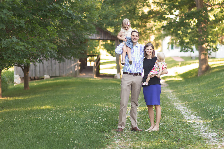 Family of four standing on dirt road in Faust Park | St. Louis Photos