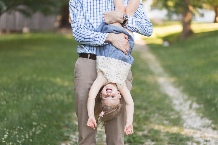 Daddy holding daughter upside down in Faust Park | St. Louis Family Photos