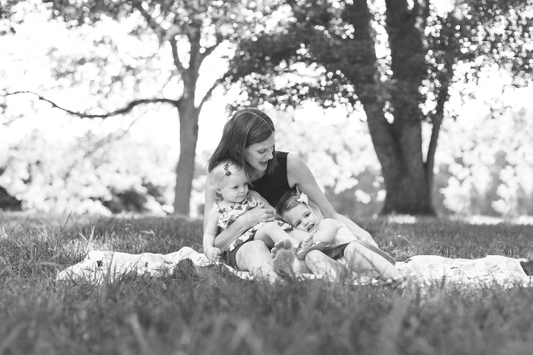 Mommy singing to her two little girls in Faust Park | St. Louis Photography