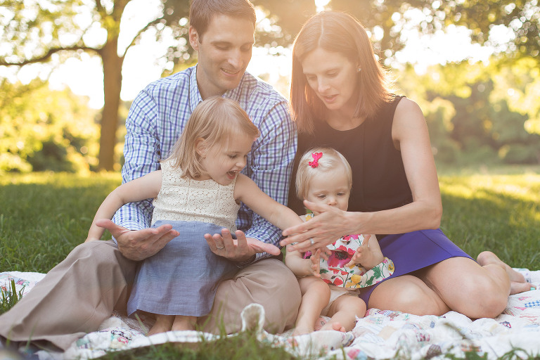 Family of four sitting together on blanket in Faust Park | St. Louis Children's Photography