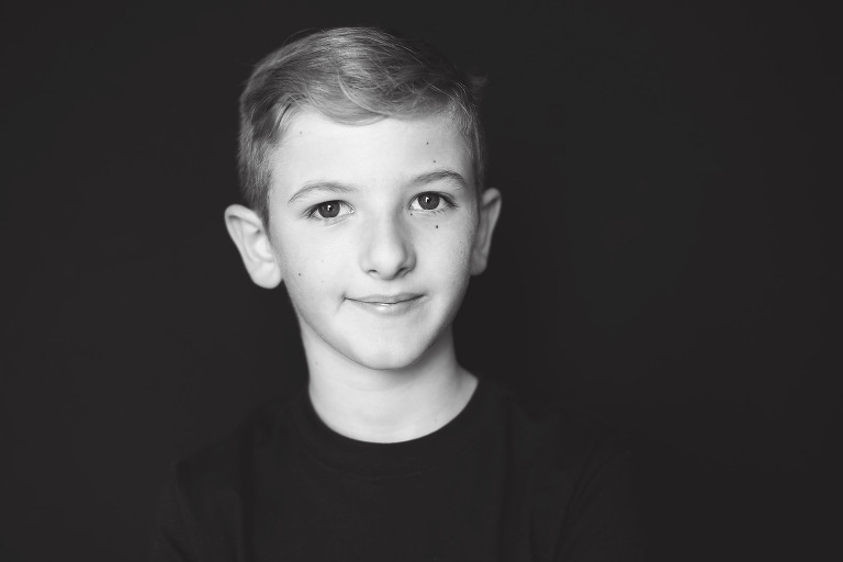 Sweet young boy looking at camera | St. Louis School Pictures