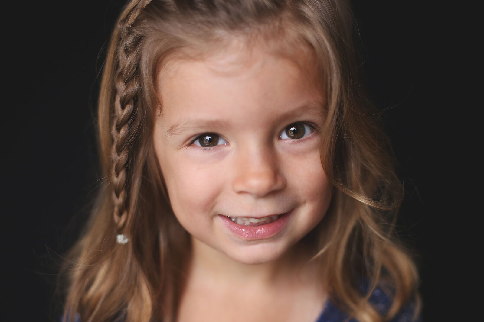 Young girl with big brown eyes and a sweet smile | St. Louis School Portraits