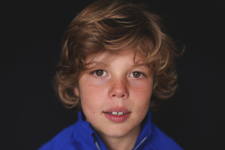 Young boy looking directly at camera | St. Louis School Photographer