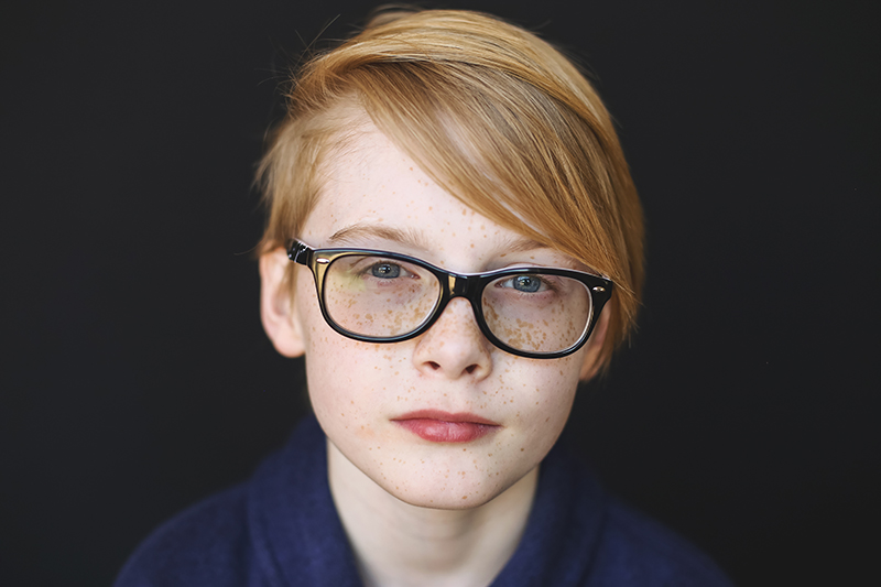 Pre teen with red hair and glasses | St. Louis School Photographer